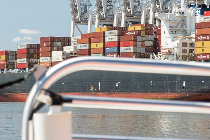 a man driving a boat in the water