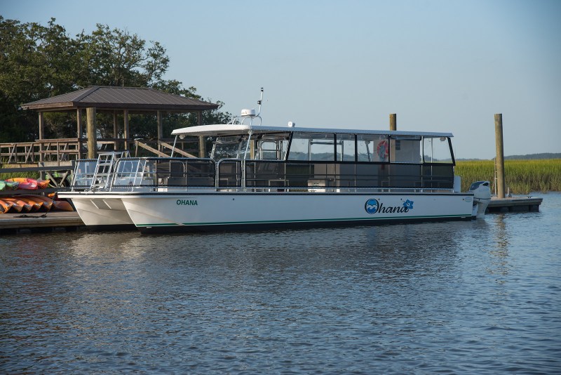 a boat is docked next to a body of water