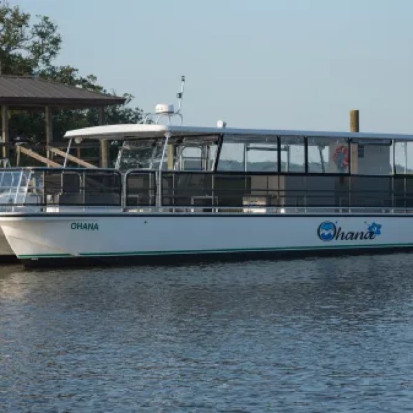 a boat is docked next to a body of water