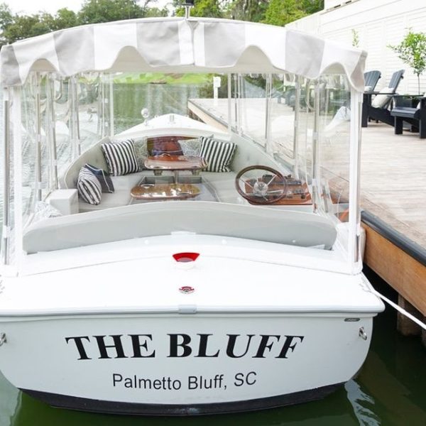 a boat sitting on top of a car